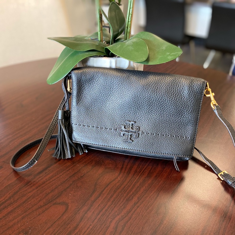 Tory Burch pocketbook. One shoulder or crossbody. Cute tassel detail. Black bag.